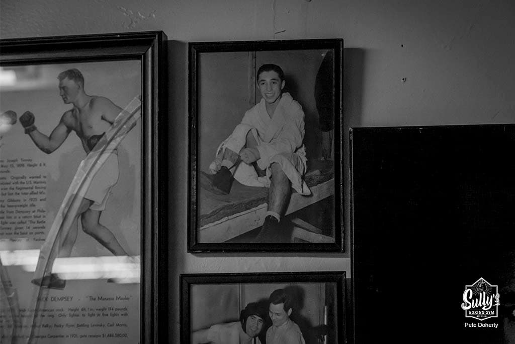 Historical boxing photos on the wall at Sully's